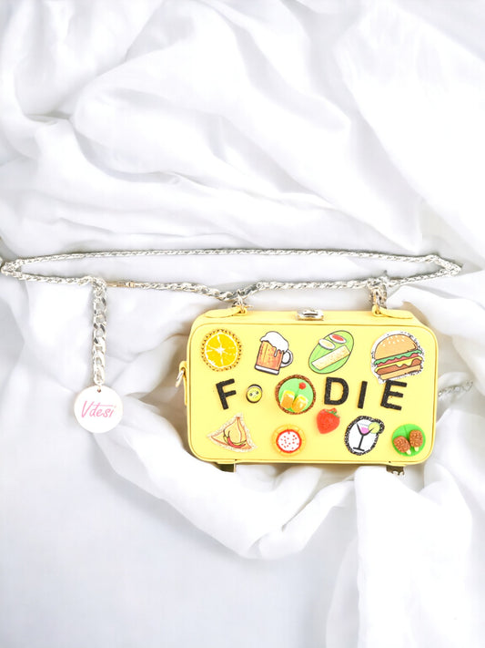 A ladies foodie waist bag on a plain white background.