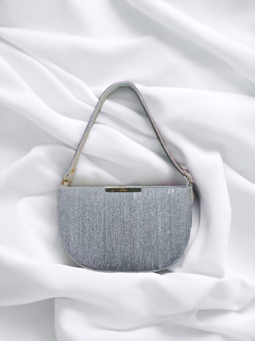 With its spacious interior and comfortable shoulder strap, it's perfect for everyday use and special occasions alike. Elevate your style with our chic shoulder bag today.