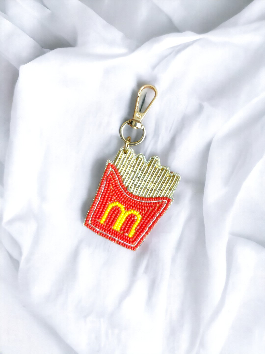 Introducing the latest must-have accessory for any true MCDonald's aficionado: the MCD Fries bag charm! 
