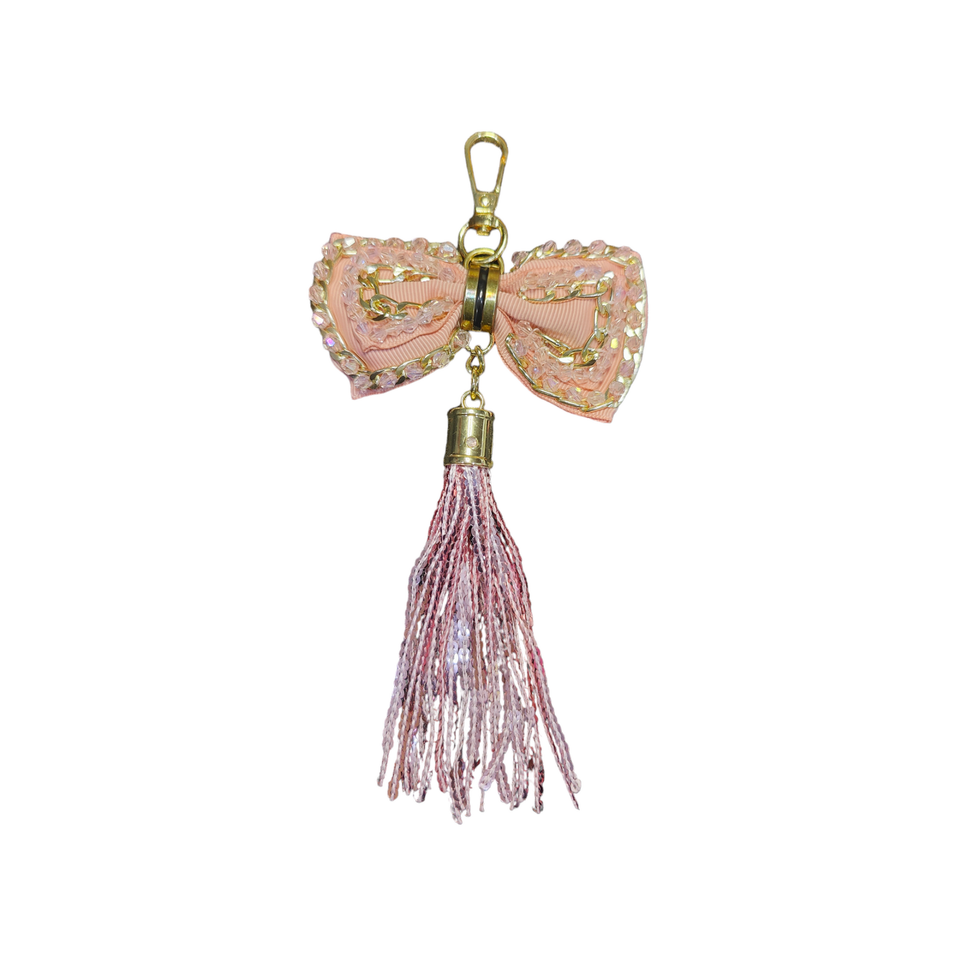 A Vdesi peach tassel bag charm with a bow that will elevate the look of your bag. 
