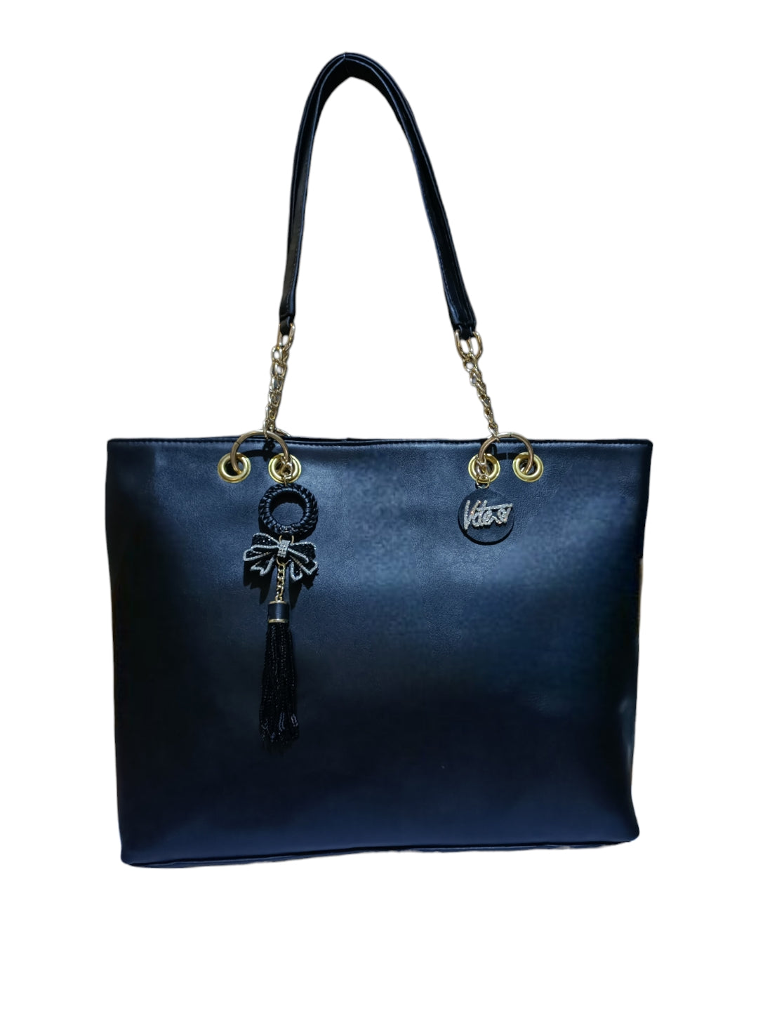 A Vdesi tote bag with bow & tassel. 