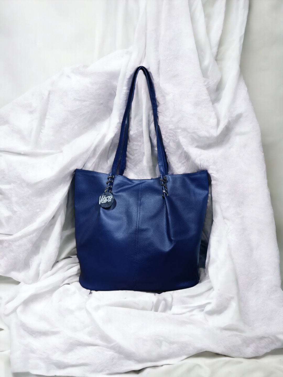 Whether you're running errands or heading to the office, our Tote Bag keeps you organized and on-trend with ease.