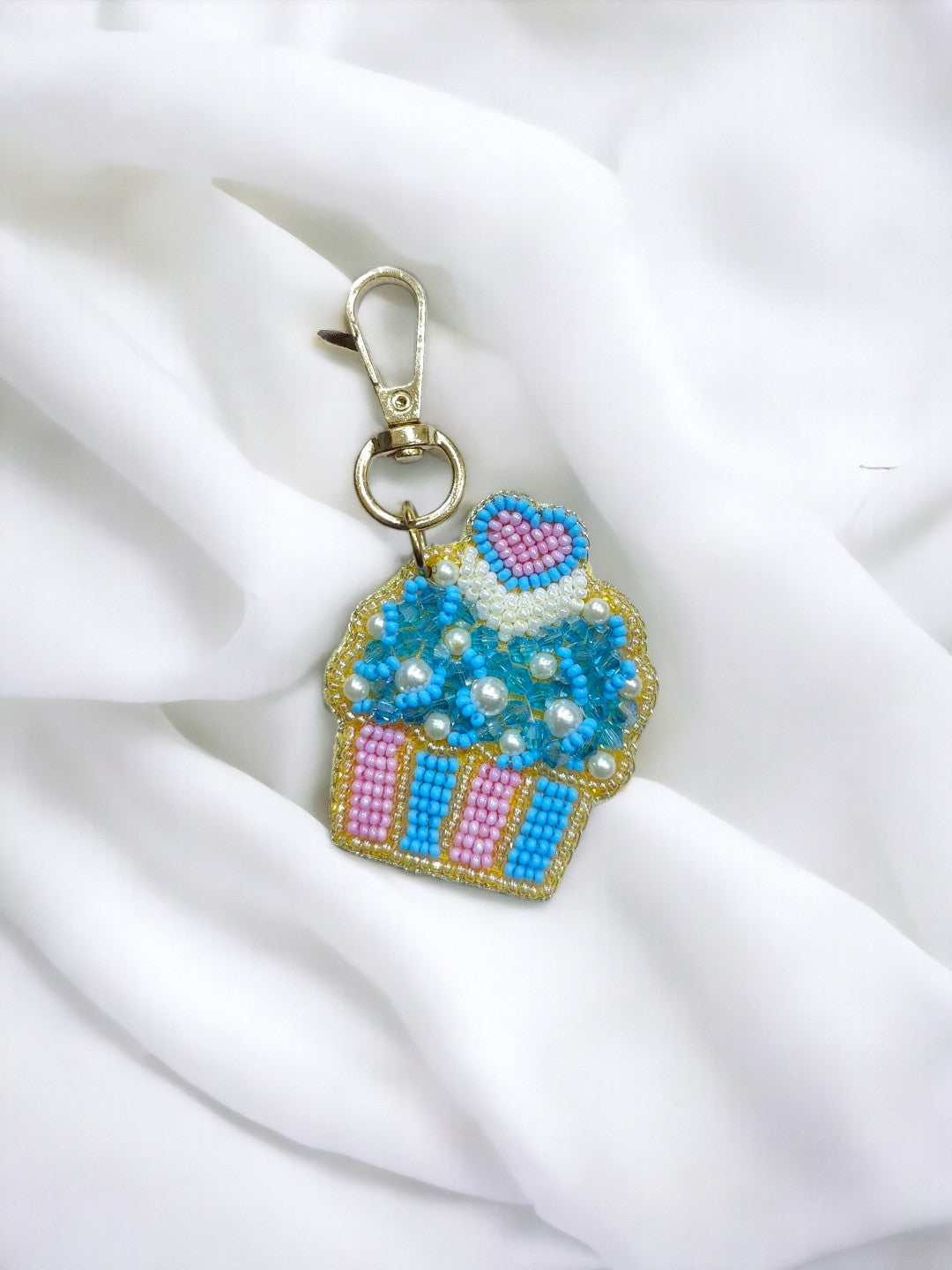 A colourful cupcake bag charm which will add sweetness to your stye.  